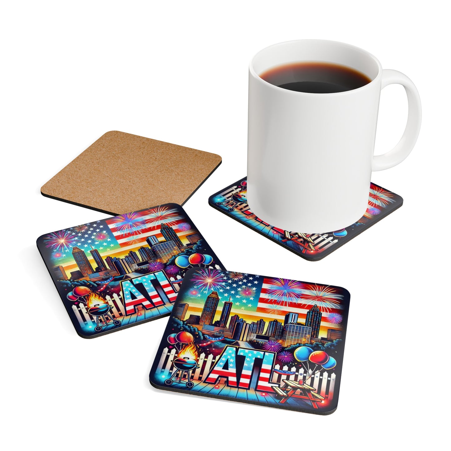 Set of colorful Atlanta-themed drink coasters featuring the city skyline, fireworks, American flag, balloons, BBQ grill, and picnic table. Includes a cork backing for durability, shown with a coffee mug resting on one of the coasters.