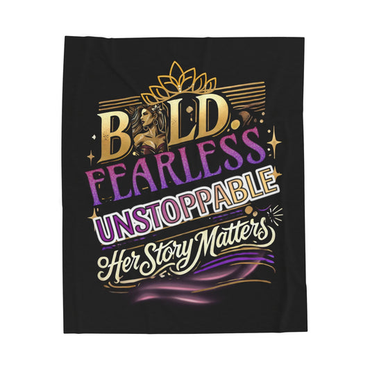 A black fleece blanket featuring an empowering Women's History Month design with bold, colorful typography. The text reads “BOLD. FEARLESS. UNSTOPPABLE. Her Story Matters.” in gold, purple, and white lettering. A stylized illustration of a strong woman with flowing hair is incorporated into the word "BOLD," with a golden crown-like motif above. Swirling accents in purple and gold enhance the design, symbolizing strength, confidence, and empowerment. Perfect for celebrating Women's History Month, feminism, a