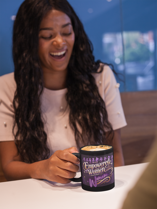 A beautifully designed Empowered Women Empower Women coffee mug featuring an elegant script in gold and purple tones. The ceramic mug showcases an inspiring message, perfect for Women's History Month, feminist gifts, and daily motivation. Ideal for coffee, tea, or as an empowerment-themed desk accessory.