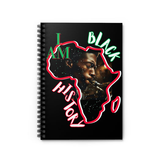 Spiral notebook with a black cover featuring the design 'I Am Black History,' showcasing a red, green, and white outline of the African continent with a powerful portrait inside, and bold text celebrating Black pride and heritage