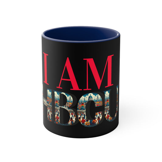 Black coffee mug with bold red text that reads 'I AM' and large letters spelling 'HBCU' filled with a vibrant collage of HBCU imagery, including graduates and historic campus scenes. The interior of the mug is navy blue