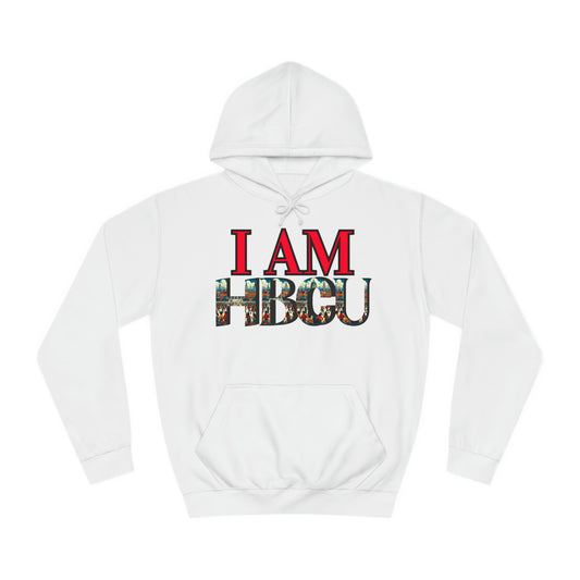 "White hoodie featuring bold red text that reads 'I AM' above large letters spelling 'HBCU,' filled with a vibrant collage of HBCU imagery, including graduates and historic campus scenes