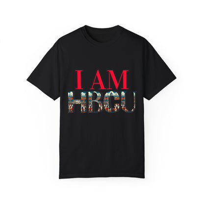 Black T-shirt featuring bold red text that reads 'I AM' above large letters spelling 'HBCU,' filled with a vibrant collage of HBCU imagery, including graduates and historic campus scenes