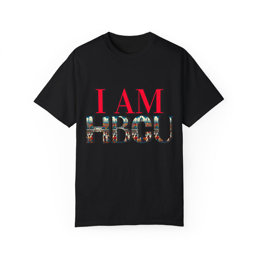Black T-shirt featuring bold red text that reads 'I AM' above large letters spelling 'HBCU,' filled with a vibrant collage of HBCU imagery, including graduates and historic campus scenes