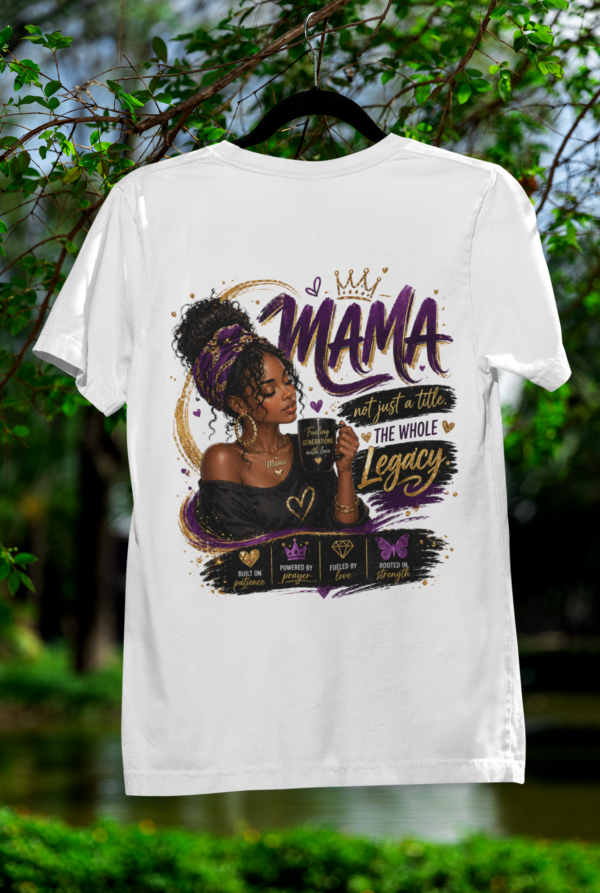 White t-shirt with a graphic design featuring a woman and text, hanging against a natural background.